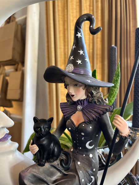 Witch Sitting on Crescent Moon