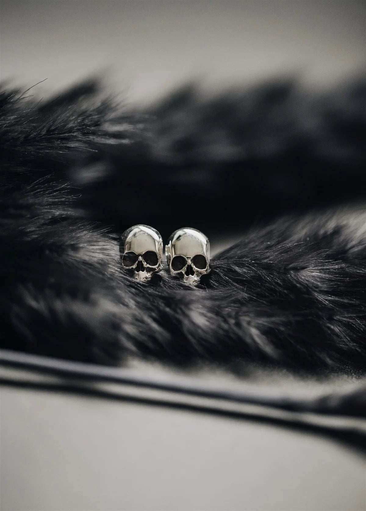 P + G Skull Studs Earrings