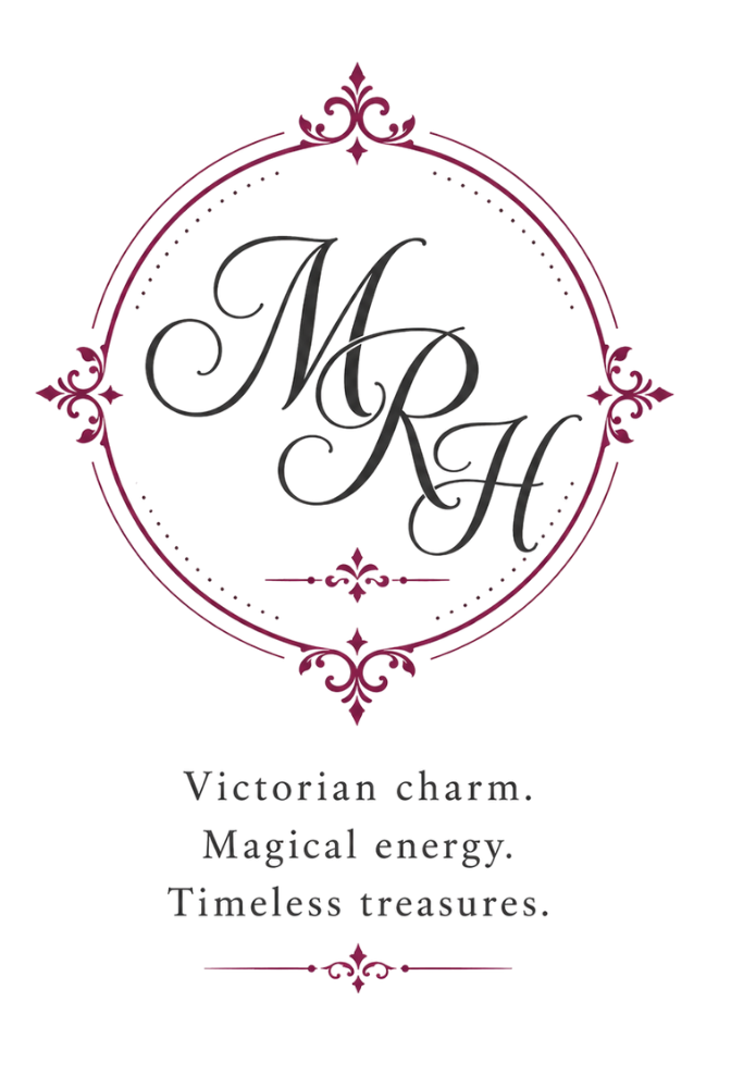 Decorative monogram 'MRH' with ornate frame and text on a white background