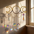 Decorative hanging with crystal elements in front of a window